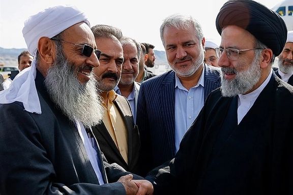 Abdolhamid (L) with President Raisi during the 2021 presidential election