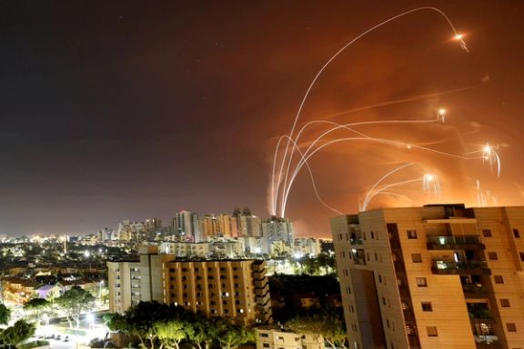 Streaks of light are seen as Israel's Iron Dome anti-missile system intercepts rockets launched from the Gaza Strip towards Israel, as seen from Ashkelon, Israel, May 12 2021.