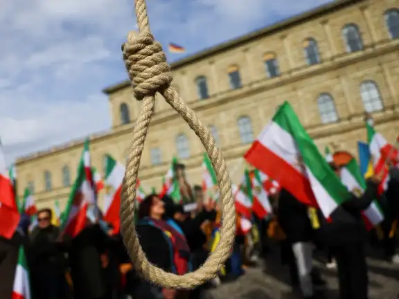 A noose is seen as people hold Iranian flags during a protest on the day of the Munich Security Conference, in Munich, Germany February 17, 2023.