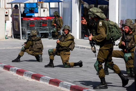 Israeli soldiers work to secure residential areas following a mass-infiltration by Hamas gunmen from the Gaza Strip, in Sderot, southern Israel, October 7. REUTERS/Ammar Awad