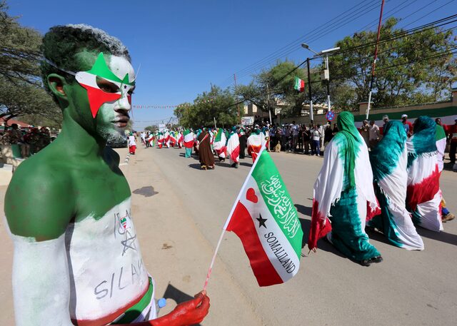 A man with body paint in the colors of the national flag of Somaliland participates in a street parade to celebrate the 24th self-declared independence day for the breakaway Somaliland nation from Somalia in capital Hargeysa, May 18, 2015.