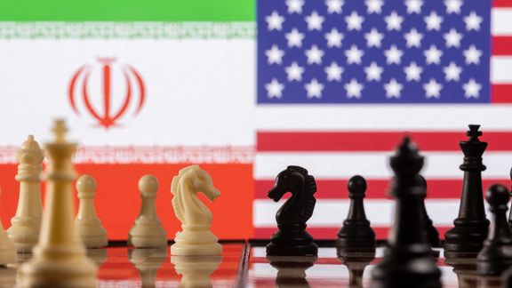 Chess pieces are seen in front of displayed Iran's and US flags in this illustration taken January 26, 2022.