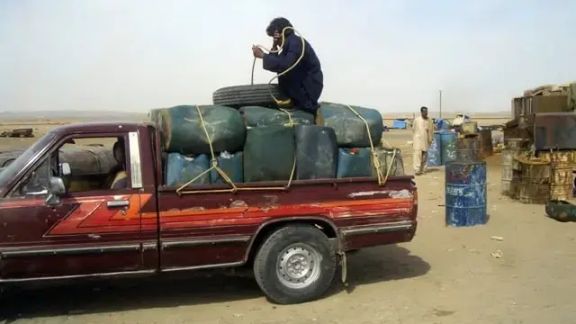 A pickup truck loaded with canisters of gasoline destined for Pakistan
