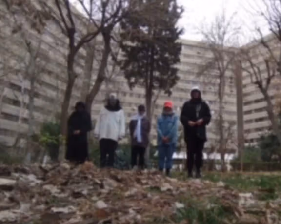 A shot from the video of forced confessions by teenage girls who had danced in public