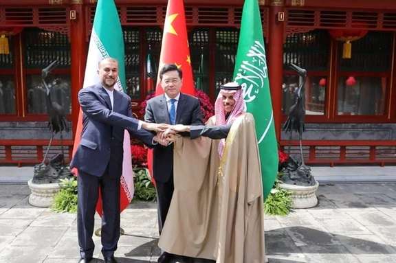 Iranian Foreign Minister Hossein Amir-Abdollahian and Saudi Arabia's Foreign Minister Prince Faisal bin Farhan Al Saud and Chinese Foreign Minister Qin Gang shake hands during a meeting in Beijing, April 6, 2023