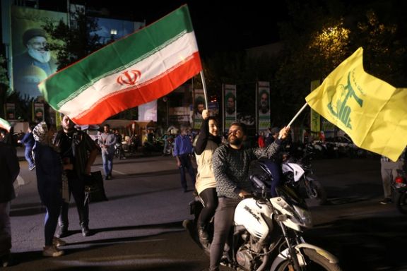 Iranians celebrate on a street, after the IRGC attack on Israel, in Tehran, Iran, October 1, 2024.