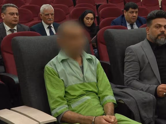 Image from Mizan News shows the attacker, face blurred, sitting in court during his trial over the Azerbaijani embassy shooting.
