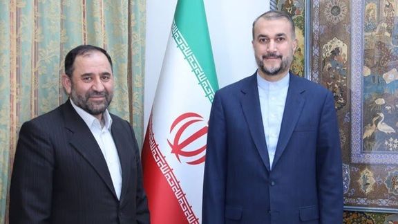 Iran's ambassador to Syria, Hossein Akbari (left) and Foreign Minister Hossein Amir-Abdollahian