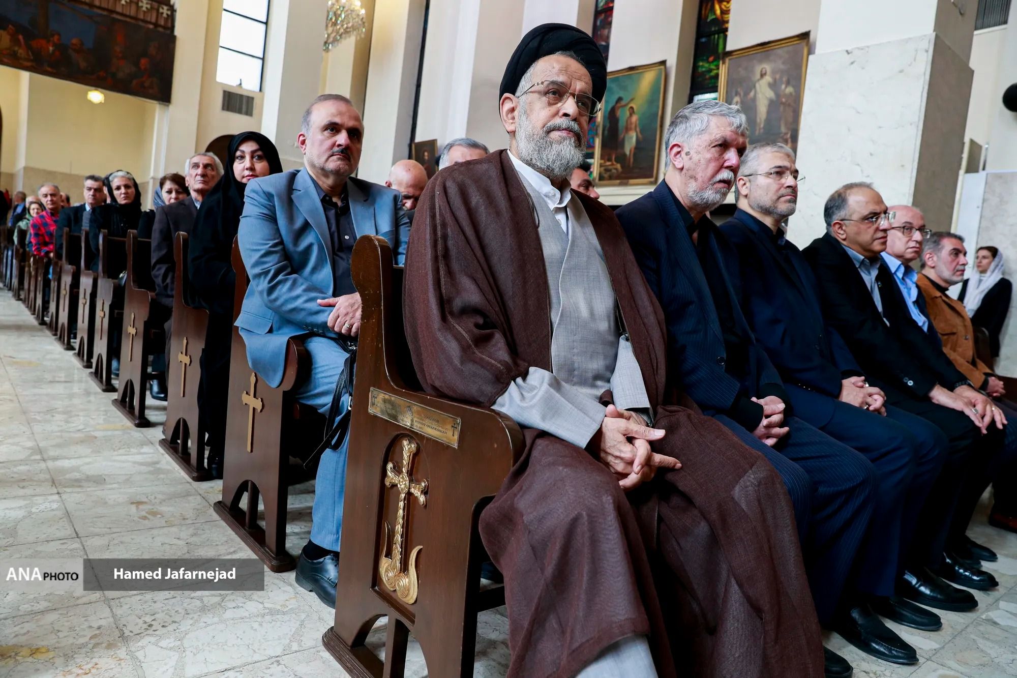 Iran’s former intelligence minister Mahmoud Alavi (front row, left) and Culture Minister Abbas Salehi (front row, right) attend a memorial ceremony in a church in Tehran on April 8, 2026.