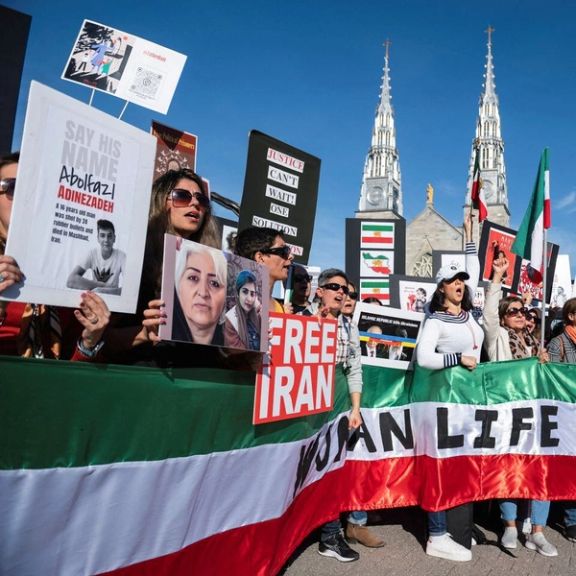 Protestors in support of women in Iran hold a banner reading 'Women Life Freedom' during a protest following the death of Mahsa Amini, in Ottawa, Ontario, Canada, October 29, 2022.