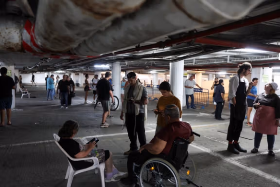 People take shelter amid missile attacks from Iran, in Tel Aviv, Israel, June 17, 2025.