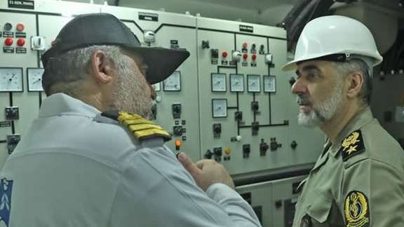 Iranian Defense Minister Brigadier General Mohammad-Reza Gharaei Ashtiani (right)