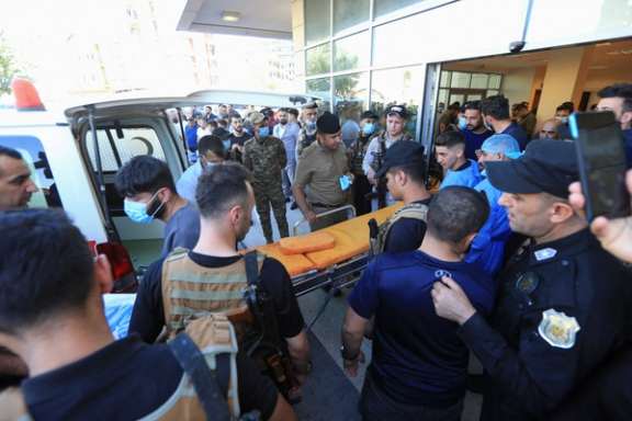 People taking the wounded to a hospital after an artillery attack in Dohuk, Iraq. July 20, 2022