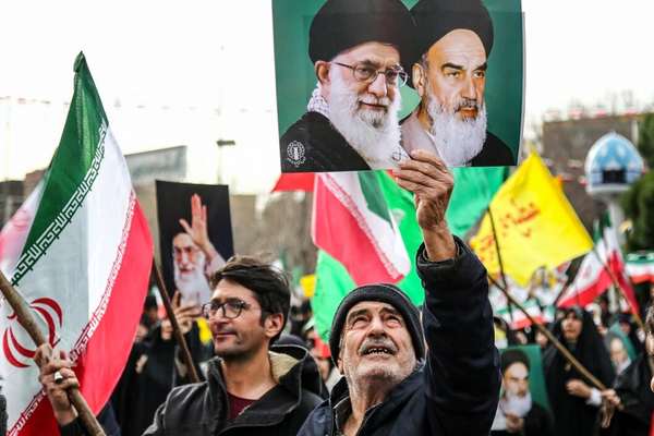 Tehran's cautious talk signals meet Revolution Day rhetoric