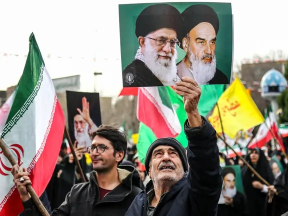 Tehran's cautious talk signals meet Revolution Day rhetoric