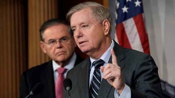Senator Lindsey Graham speaking as Bob Menendez looks on.