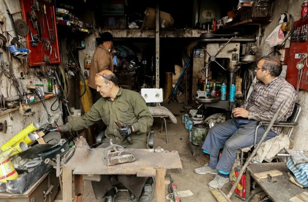 Iran’s truck repair hub feels the squeeze as work dries up