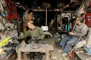 Iran’s truck repair hub feels the squeeze as work dries up