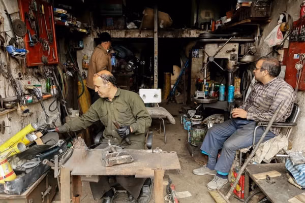 Iran’s truck repair hub feels the squeeze as work dries up