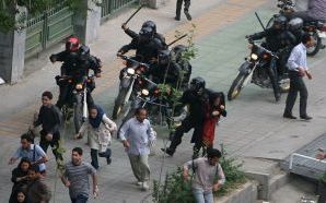 Special riot police attacking protesters in Tehran, in June 2009