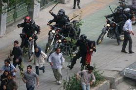 Special riot police attacking protesters in Tehran, in June 2009