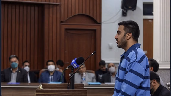 A photo of Majidreza Rahnavard in court where he was forced to say he was eager to be punished. Nov. 30, 2022