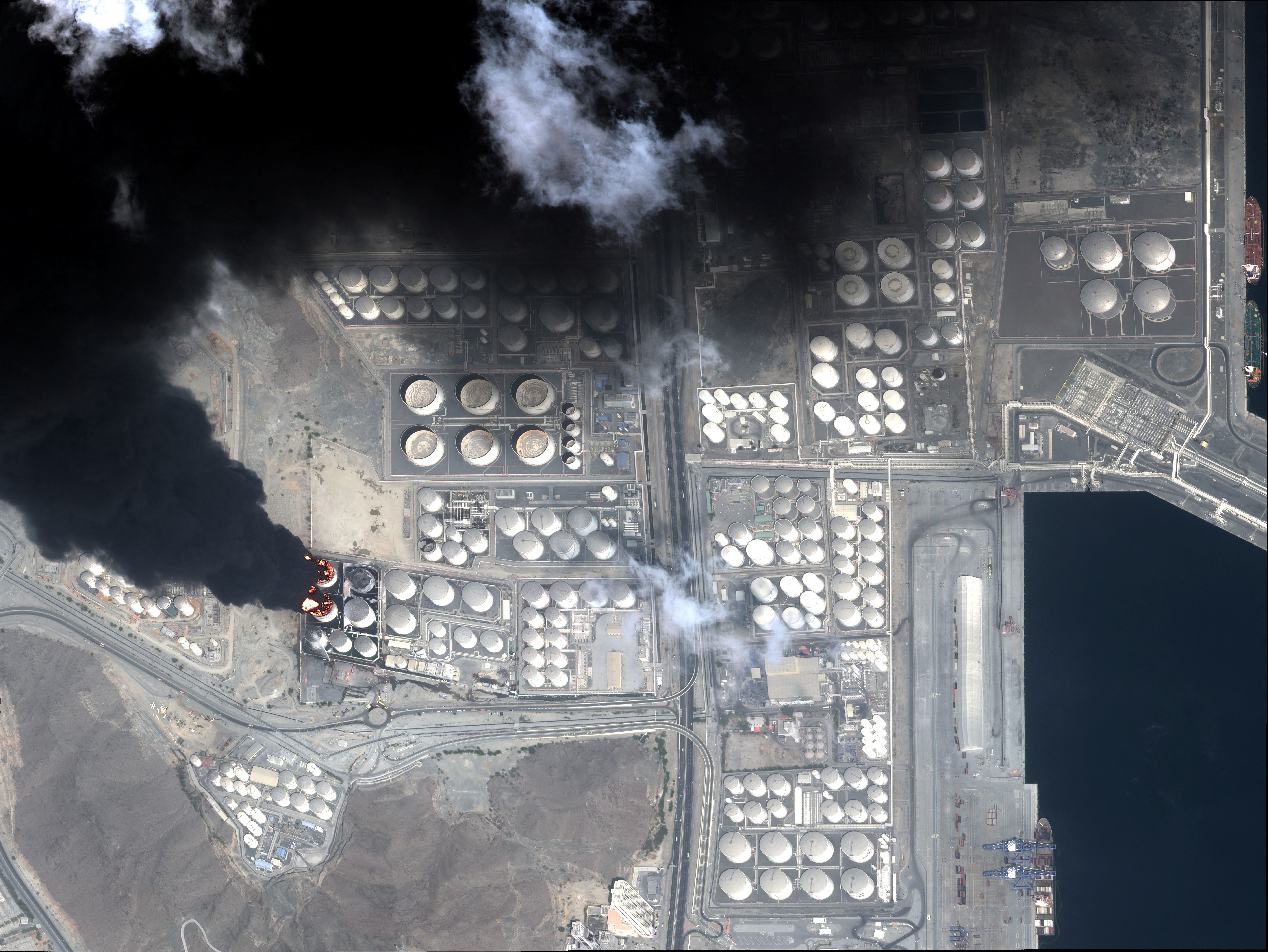 A satellite image taken March 5, 2026, at the United Arab Emirates port of Fujairah after an attack on March 3, 2026, shows tanks burning. 