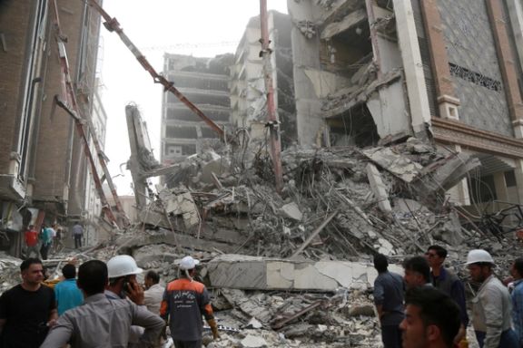 Rescue crews work at the site of a ten-storey building collapse in Abadan, Iran May 23, 2022.
