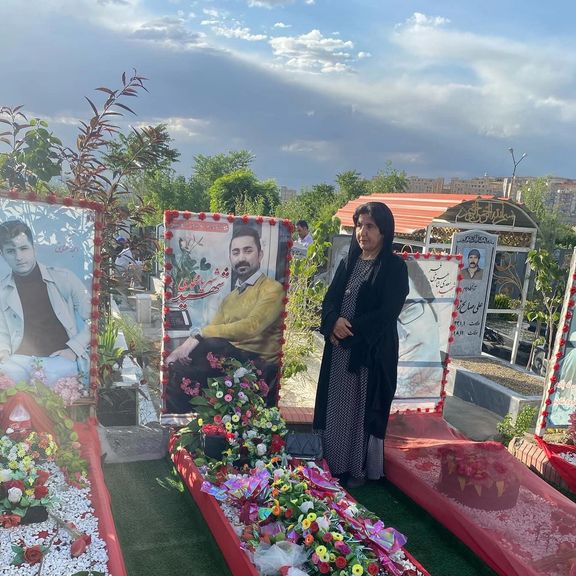 Mina Soltani at her son Shahryar Mohammadi's burying place