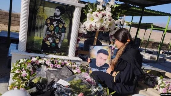 Zahra Saeedianjoo at the grave of her brother Milad Saeedianjoo