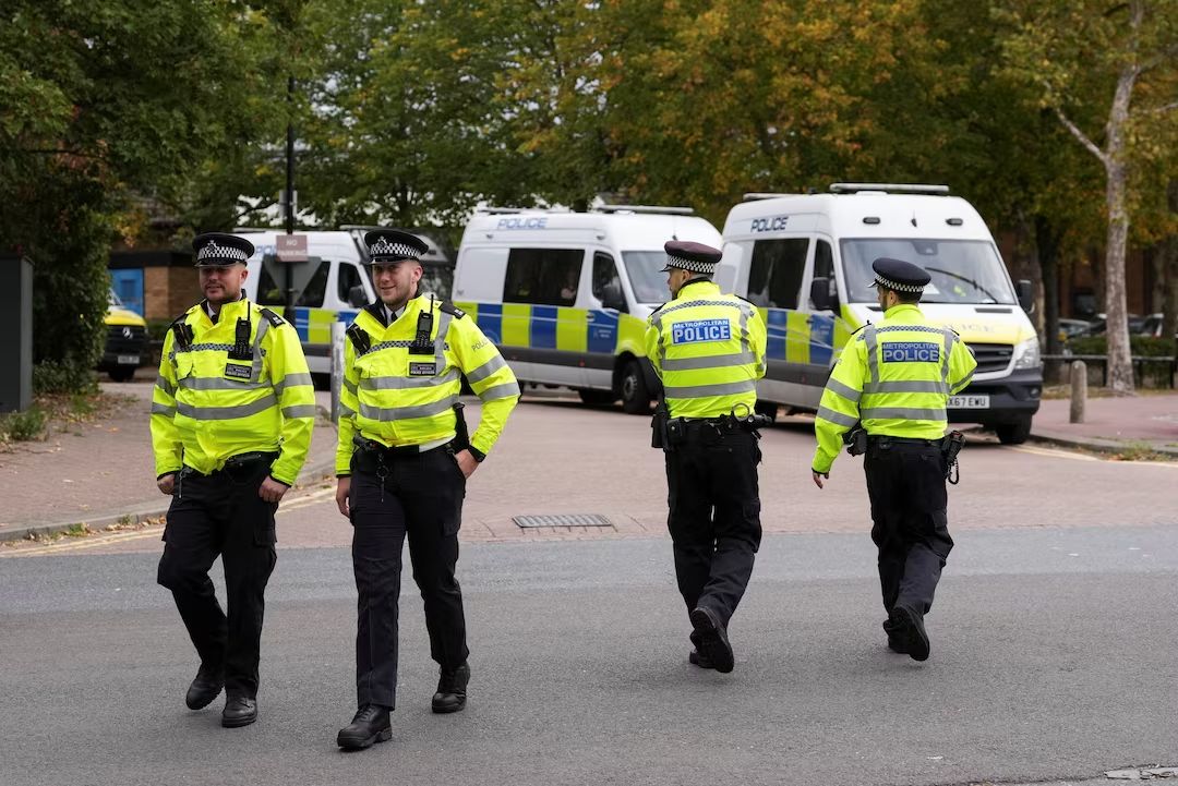 Police officers walk outside the Woolwich Crown Court in London, Britain, September 26, 2025.   