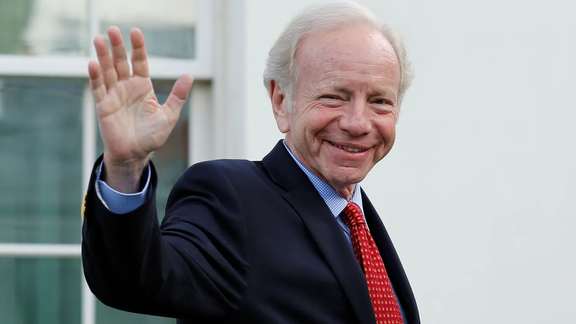 Former Connecticut Senator Joe Lieberman waves as he leaves after a meeting with former President Donald Trump for candidates for FBI director at the White House in Washington, DC, May 17, 2017.