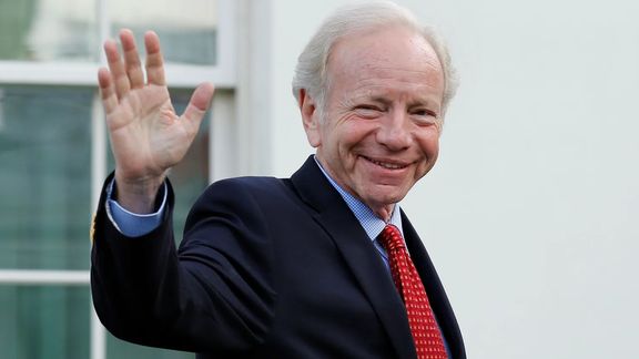 Former Connecticut Senator Joe Lieberman waves as he leaves after a meeting with former President Donald Trump for candidates for FBI director at the White House in Washington, DC, May 17, 2017.