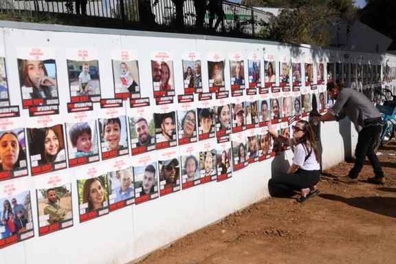 People place pictures of people who were kidnapped by Hamas gunmen on October 7 prior to a demonstration to demand immediate release of the hostages, outside the Knesset, Israeli parliament in Jerusalem, November 6, 2023.