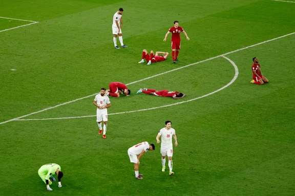 Players react after Qatar defeated Iran in the AFC Asian Cup semifinal match in Doha, Qatar - February 7, 2024