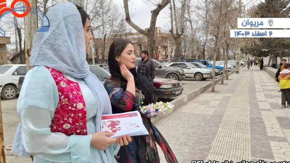 Kurdish activists distributing leaflets on International Mother Language Day in Marivan, Iran