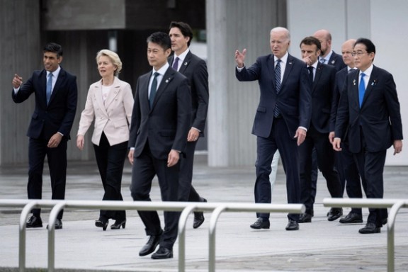 Britain's Prime Minister Rishi Sunak, European Commission's President Ursula von der Leyen, Canada's Prime Minister Justin Trudeau, US President Joe Biden, France's President Emmanuel Macron, European Council's President Charles Michel, Germany's Chancellor Olaf Scholz and Japan's Prime Minister Fumio Kishida visit the Peace Memorial Park as part of the G7 Leaders' Summit in Hiroshima on May 19, 2023.