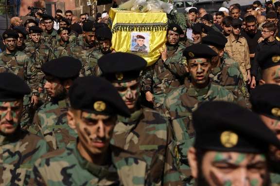Members of Hezbollah carry the coffin of Hezbollah member Abbas Shuman, who was killed in southern Lebanon amidst tension between Israel and Hezbollah, during his funeral in Baalbek, Lebanon, October 23, 2023.