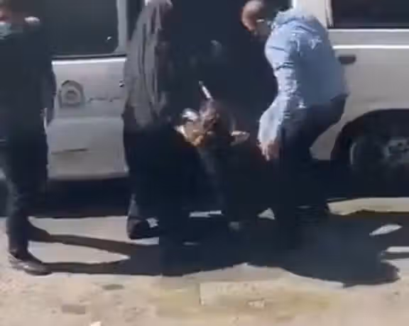Hijab enforcement patrols arresting a woman violently in Tehran