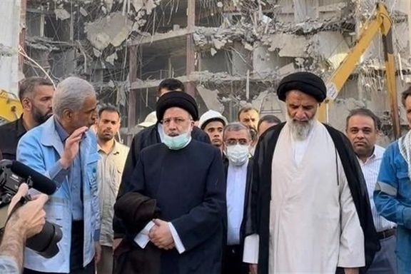 Iranian President Ebrahim Raisi visits the site of the collapsed Metropol building in Abadan on June 3, 2022.