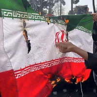 Iranian students burn flag, signaling a new phase in state–society rupture