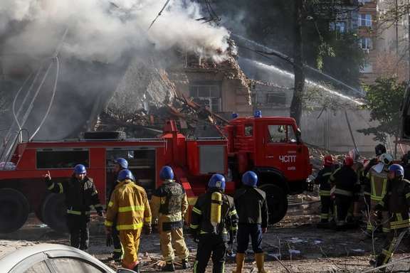 Ukranian emergency services deal with the aftermath of a Russian drone attack in Kyiv