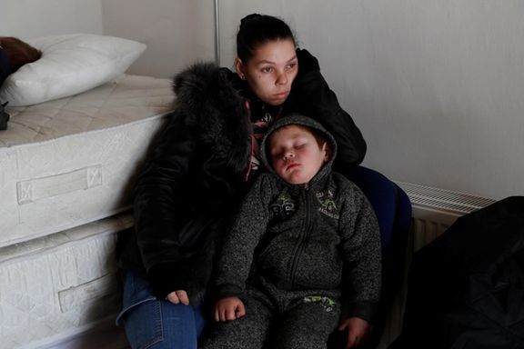 A woman and a child from Ukraine rest at a refugee shelter, in Beregsurany, Hungary March 1, 2022.