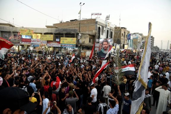 Sadr's supporters celebrating victory after preliminary election results on October 22, 2021