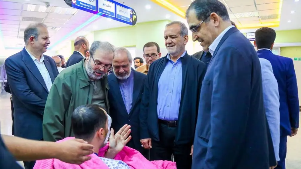 Iran's President Masoud Pezeshkian visits one of the victims injured by pager explosions across Lebanon, in a hospital in Tehran, Iran, September 20, 2024.