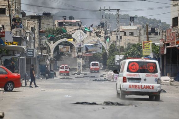 Smoke rises as ambulances drive during an Israeli military operation in Jenin, in the West Bank July 3, 2023.