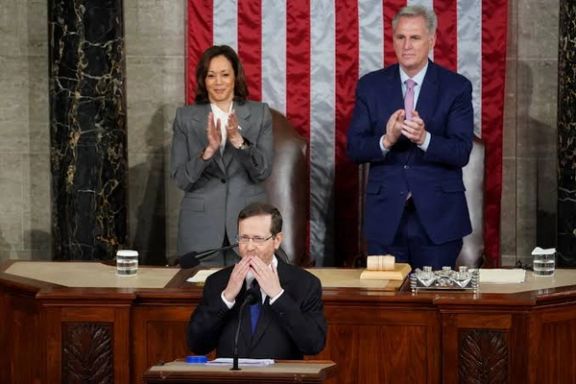 Israeli President Isaac Herzog gestures as US Vice President Kamala Harris and House Speaker Kevin McCarthy (R-CA) applaud on the day of Herzog's address to a joint meeting of Congress inside the House Chamber of the Capitol in Washington, July 19, 2023.