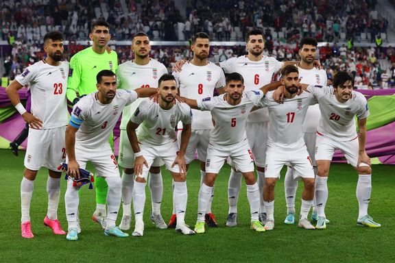 Iran players pose for a team group photo before the match