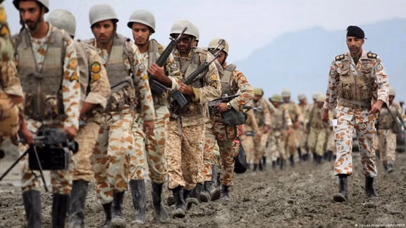 Iranian soldiers from the country’s regular army (Artesh) take part in a military drill near the Strait of Hormuz.