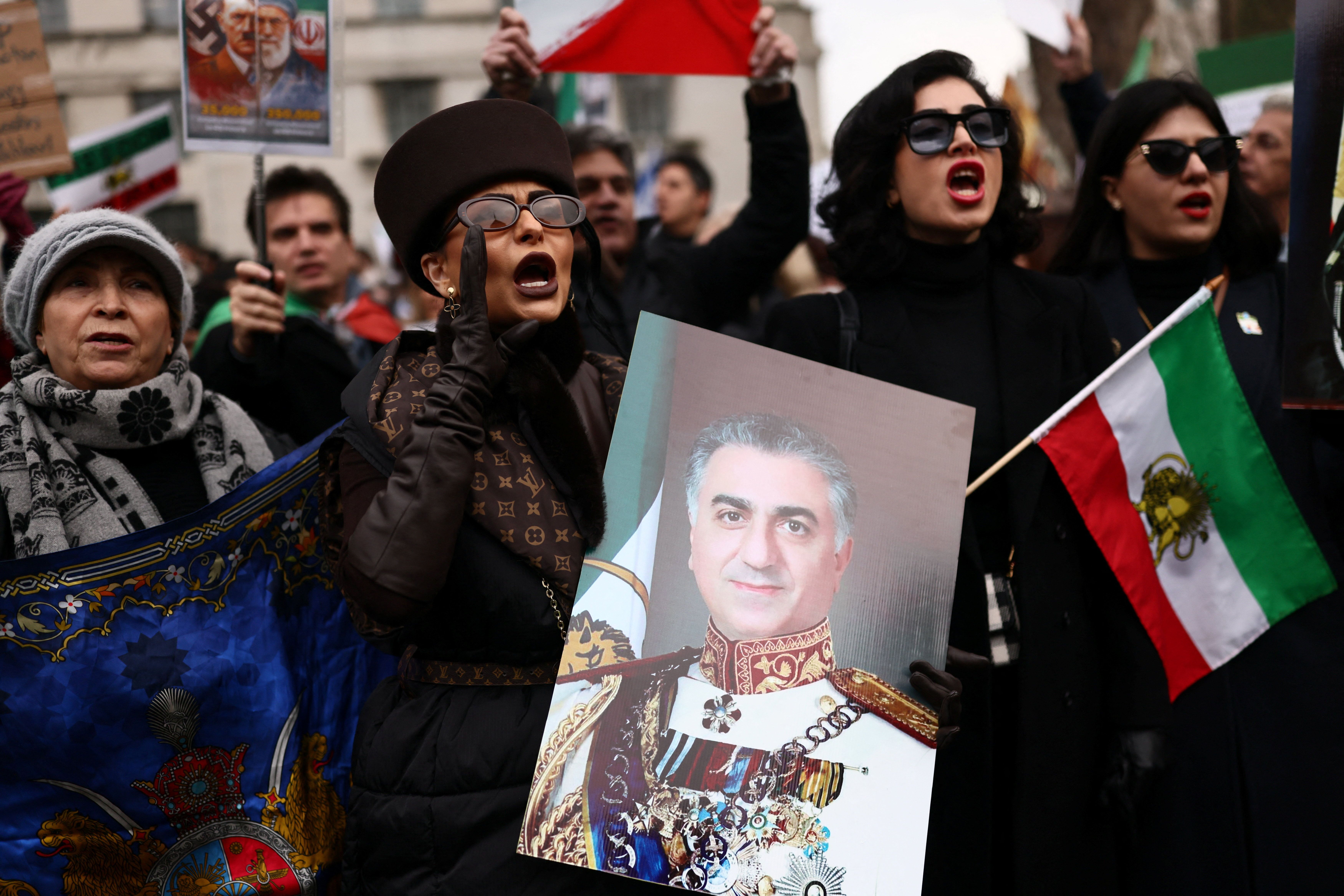 A woman holds an image depicting Iranian opposition figure Reza Pahlavi, during a demonstration in support of the nationwide protests in Iran, in London, Britain, January 25, 2026.